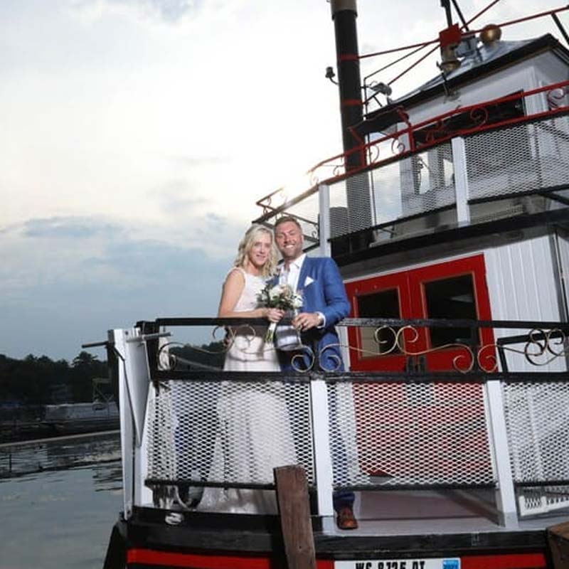 Bride and groom after wedding ceremony on the Chief Waupaca boat on the Chain O' Lakes at Clear Water Harbor restaurant and bar in Waupaca, WI