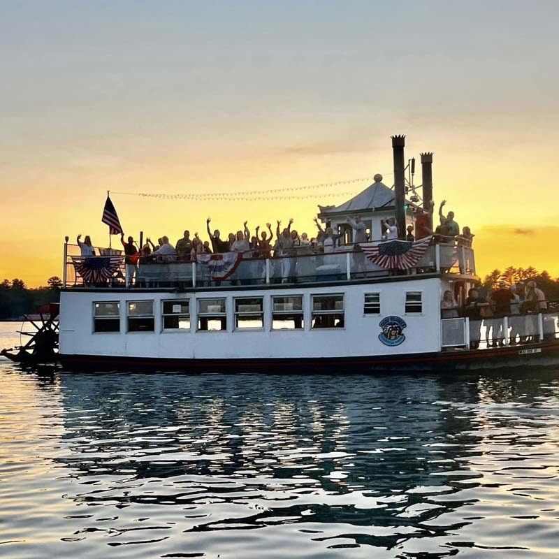 Party goers on the Chief Waupaca cruise tour boat on the Chain O' Lakes at Clear Water Harbor restaurant and bar in Waupaca, WI