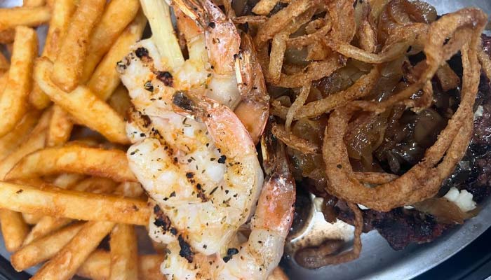 Tenderloin steak dinner with French fries and addition of shrimp daily special at Clear Water Harbor restaurant and bar in Waupaca, WI